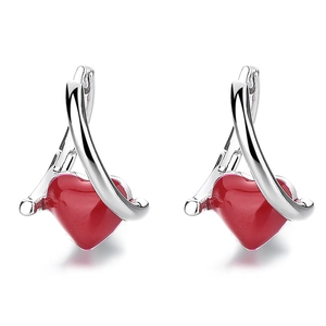 Minimalist 925 sterling silver hoop earrings with red heart enamel charms on white background