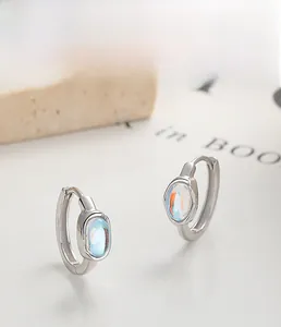 Close-up of S925 sterling silver hoop earring with rainbow moonstone and plating finish