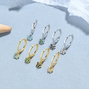 Close-up of S925 silver hoop earrings with butterfly zircon pendants in multi-color sets