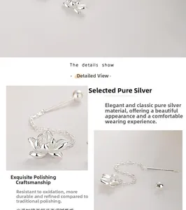 Gros plan détaillé des boucles d'oreilles lotus en argent 925 avec pampilles à chaîne fine