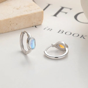 Elegant 925 sterling silver hoop earrings with oval iridescent opal stones on neutral base