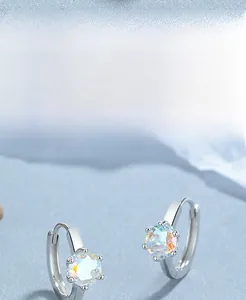 Detailed view of S925 silver aurora crystal earrings with six-prong setting and stones