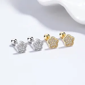 Close-up of 925 silver five-petal flower ear studs with sparkling cubic zirconia and screw back