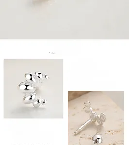 Vue détaillée des boucles d'oreilles torsadées en argent S925 avec fermoir à vis sécurisé