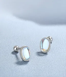 Macro shot of 925 sterling silver oval moonstone stud earrings with threaded detailing