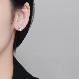 Elegant 925 sterling silver cabbage thread stud earring worn on model ear side view