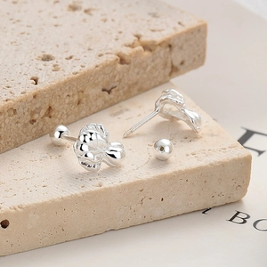 925 sterling silver cabbage screw back stud earrings on natural stone display