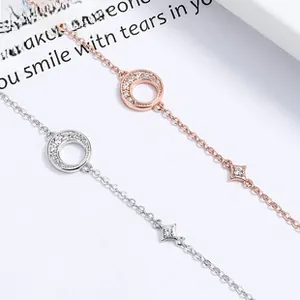 Detail of 925 silver star and moon bracelets in silver and rose gold with pavé crystals