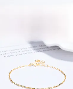 Detailed macro of S925 sterling silver rectangular link bracelet with gold plating finish