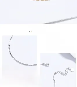 Detail of 925 sterling silver square box chain bracelet with spring clasp and heart charm