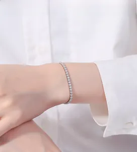 Detail of 925 silver tennis bracelet with brilliant cut diamonds on a woman's wrist