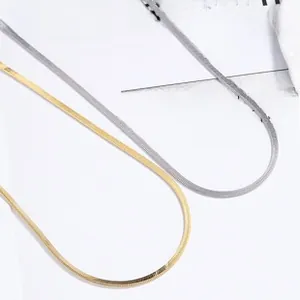 Detailed view of 925 sterling silver snake bone necklaces in gold and silver finishes