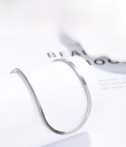 Detailed macro view of S925 sterling silver flat snake chain with multi-layer plating