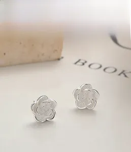 Detailed view of S925 sterling silver rose earrings with multi-layer plating and anti-oxidation finish