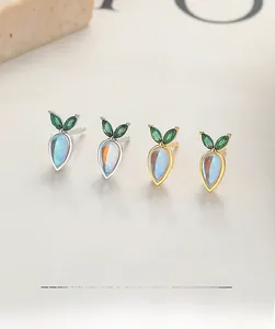 Detailed view of 925 sterling silver moonstone carrot earrings in gold and silver finish