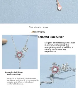 Close-up of S925 sterling silver cherry blossom necklace with pink enamel and pearl detail