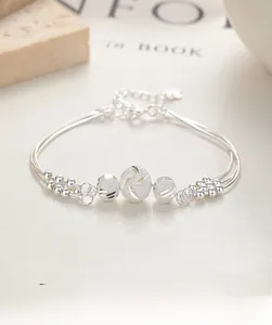Detailed macro view of S925 silver multilayer bead bracelet with adjustable chain link