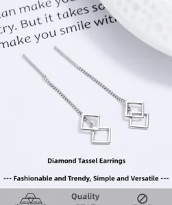 Close-up of S925 sterling silver drop threader earrings with geometric diamond tassels