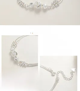 Macro detail of multi-layer sterling silver bracelet with textured transfer beads