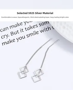 Close-up of S925 sterling silver long tassel threader earrings with geometric diamond pendants
