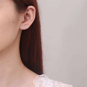 925 Sterling Silver Capricorn constellation stud earring worn on model's ear