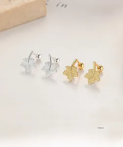 Detailed view of silver and gold maple leaf earrings crafted from S925 sterling silver