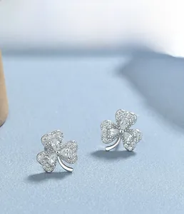 Macro shot of S925 sterling silver clover stud earrings with sparkling cubic zirconia pavé