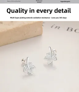 Detailed macro view of 925 silver maple leaf stud earrings with screw ball back closure