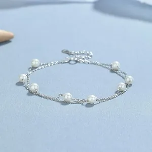 Detail of a 925 silver double-layer bracelet with 8 white pearls and adjustable clasp