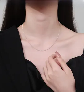 Detail of elegant 925 silver beaded choker necklace on model with refined metallic texture