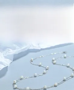 Detailed view of the S925 sterling silver layered necklace with elegant white pearls