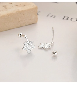 Macro shot of 925 sterling silver maple leaf earrings with threaded screw backs and veins