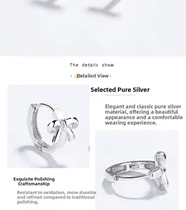 Detail view of 925 sterling silver bow earrings showing S925 hallmark and hinge mechanism