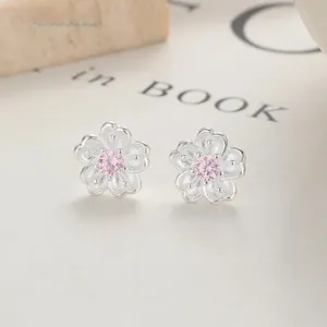 Detailed macro view of S925 sterling silver cherry blossom studs with pink cubic zirconia