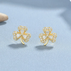 Sparkling 925 sterling silver shamrock earrings with pavé set crystals and pear-shaped stones