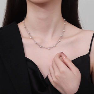 Double-layered 925 sterling silver necklace featuring elegant white pearls on a thin chain
