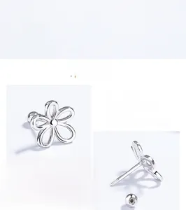 Detail of 925 sterling silver hollow flower earrings with threaded screw backs and high polish