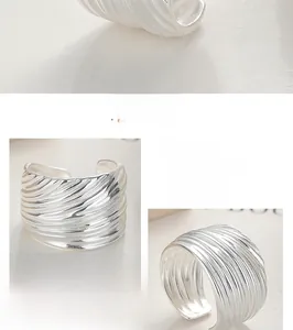 Detailed view of wide 925 sterling silver open ring with textured diagonal striped pattern