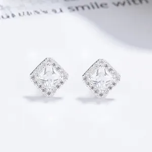 Macro shot of 925 sterling silver square halo stud earrings with brilliant pavé crystals