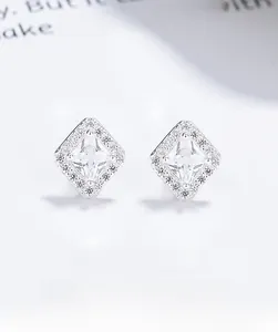 Macro shot of square 925 sterling silver stud earrings with sparkling cubic zirconia