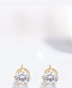 Macro detail of S925 sterling silver six-prong gold earring with brilliant round zircon