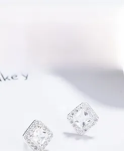 Macro shot of 925 sterling silver square stud earrings with clear pave zircon setting