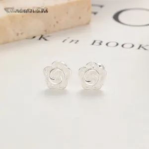 Detailed close-up of S925 silver flower stud earrings with layered petal textures