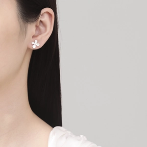 Minimalist 999 sterling silver flower stud earrings with a matte frosted finish