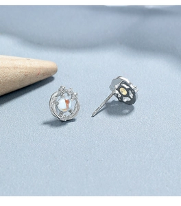 Detailed macro shot of 925 sterling silver moonstone stud earrings with intricate vine design