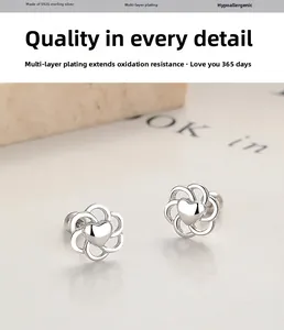Macro shot of 925 sterling silver hollow heart flower stud earrings with S925 engraving