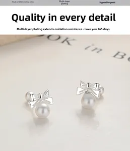Detailed view of S925 sterling silver bow earrings with elegant round white pearls