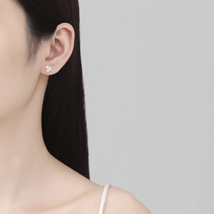 Elegant 925 sterling silver bow pearl earrings shown on a model for a graceful look