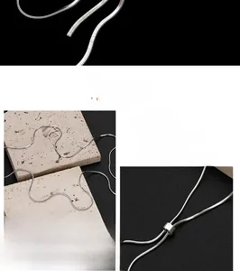 Close-up of polished sterling silver snake chain necklace with an adjustable slider clasp