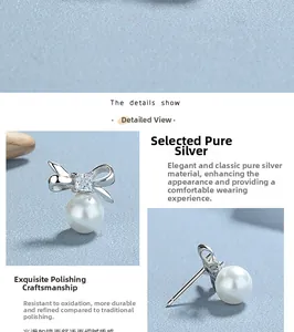 Macro detail of 925 sterling silver bow earrings featuring polished finish and white pearl